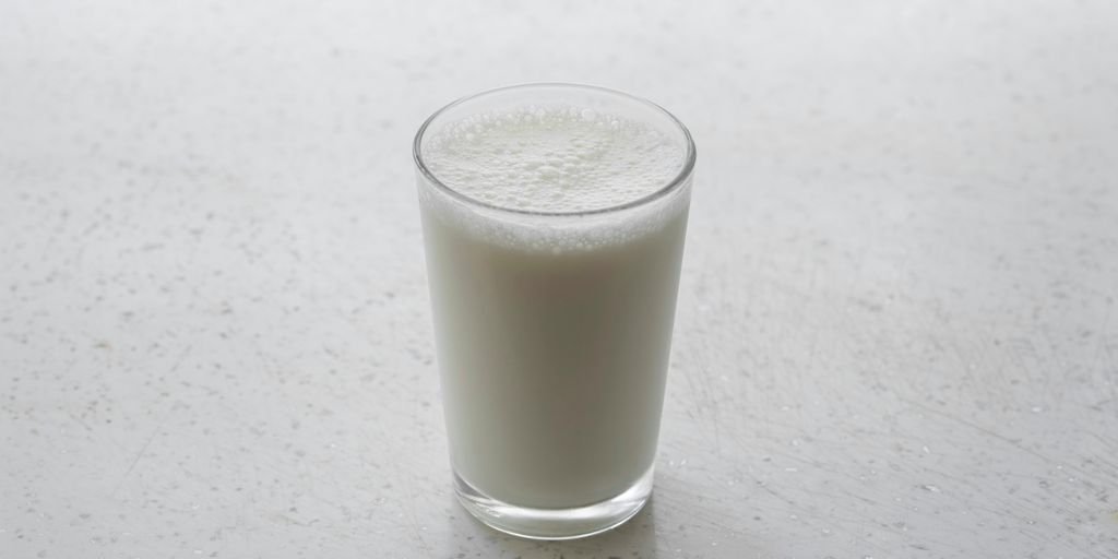 clear drinking glass with brown liquid
